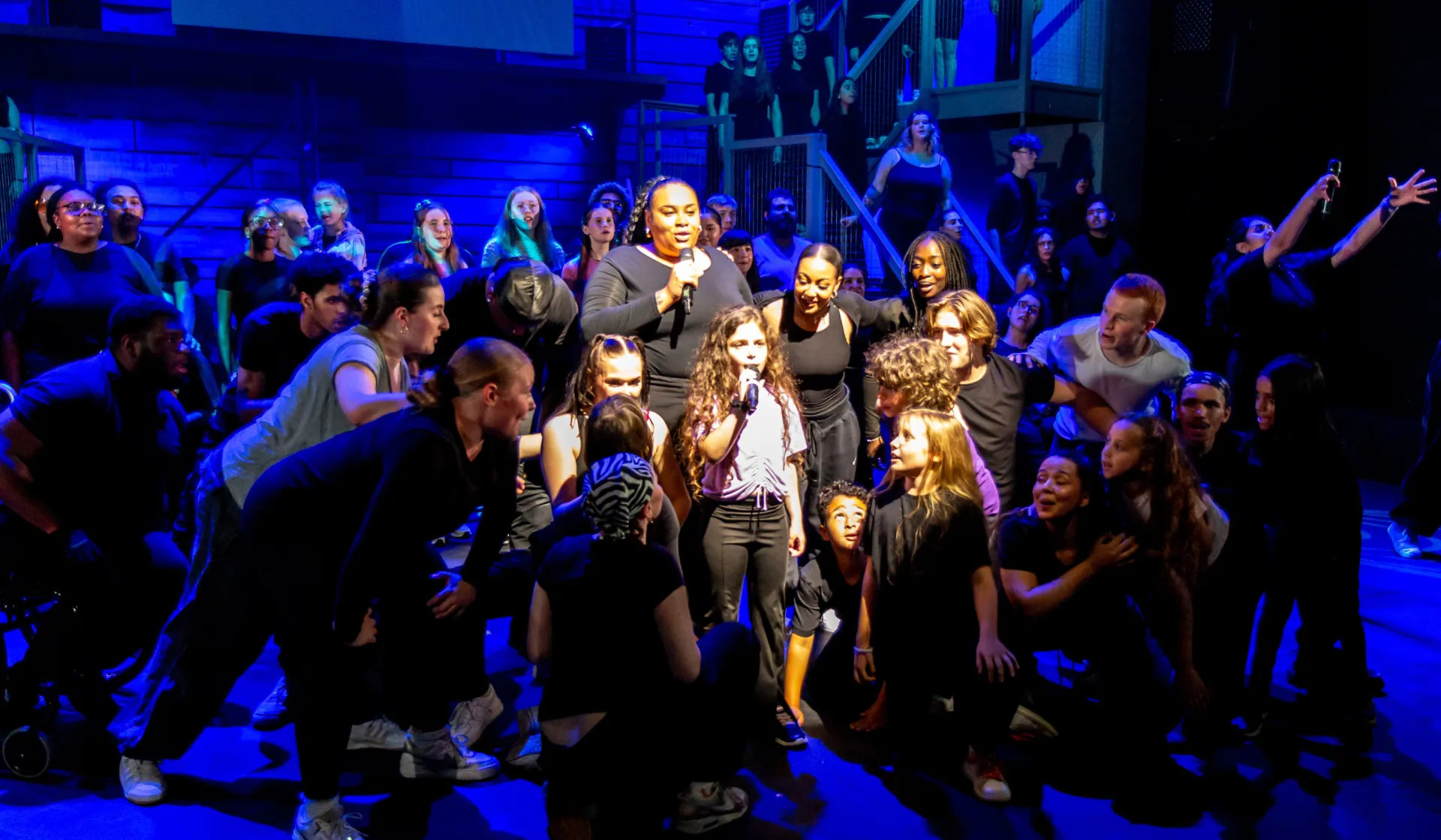 Bella singing  in we are chickenshed