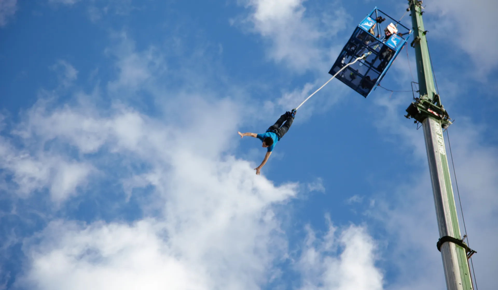 A person jumps from a platdform in a Bungee Jump