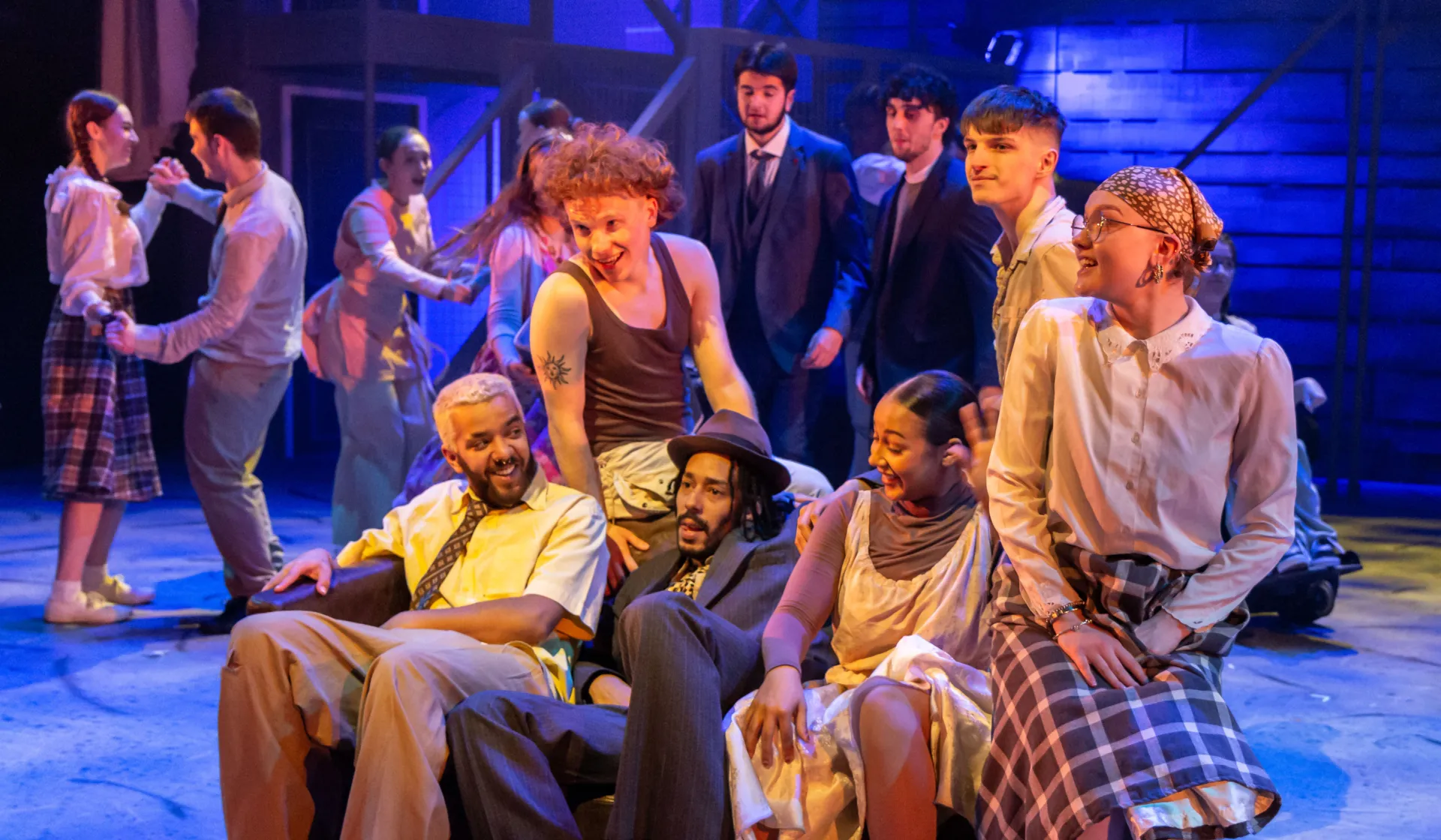 students on sofa in performance of RUSH