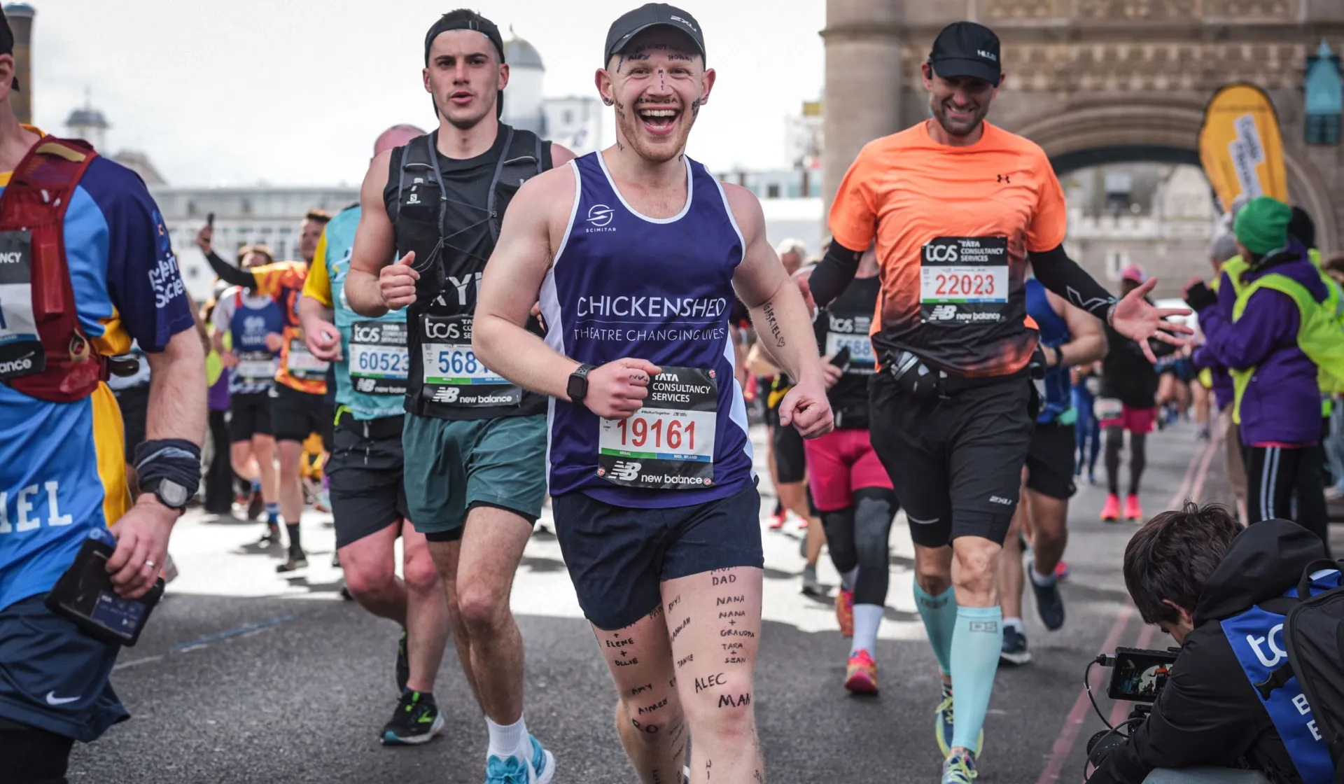 A man runs across tower bridge in the London Marathon
