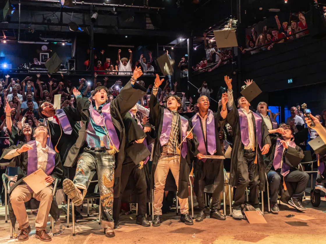 Students throw caps and celebrate graduating