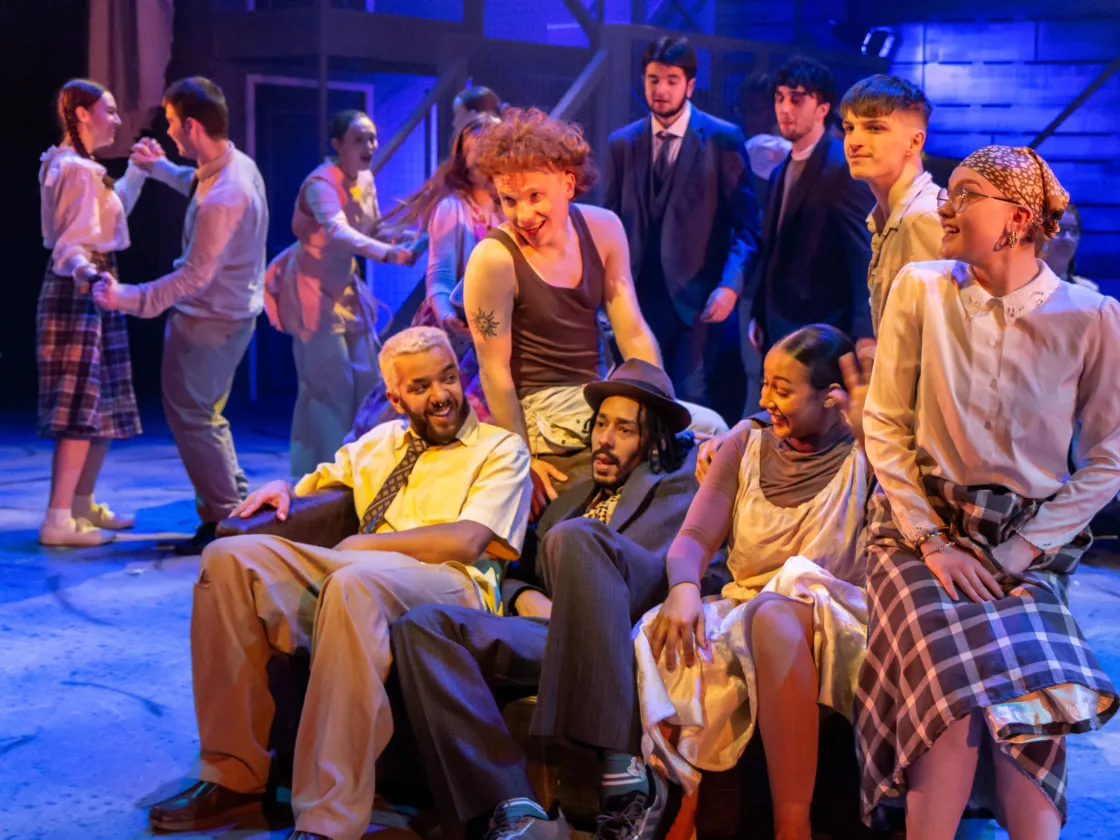 students on sofa in performance of RUSH