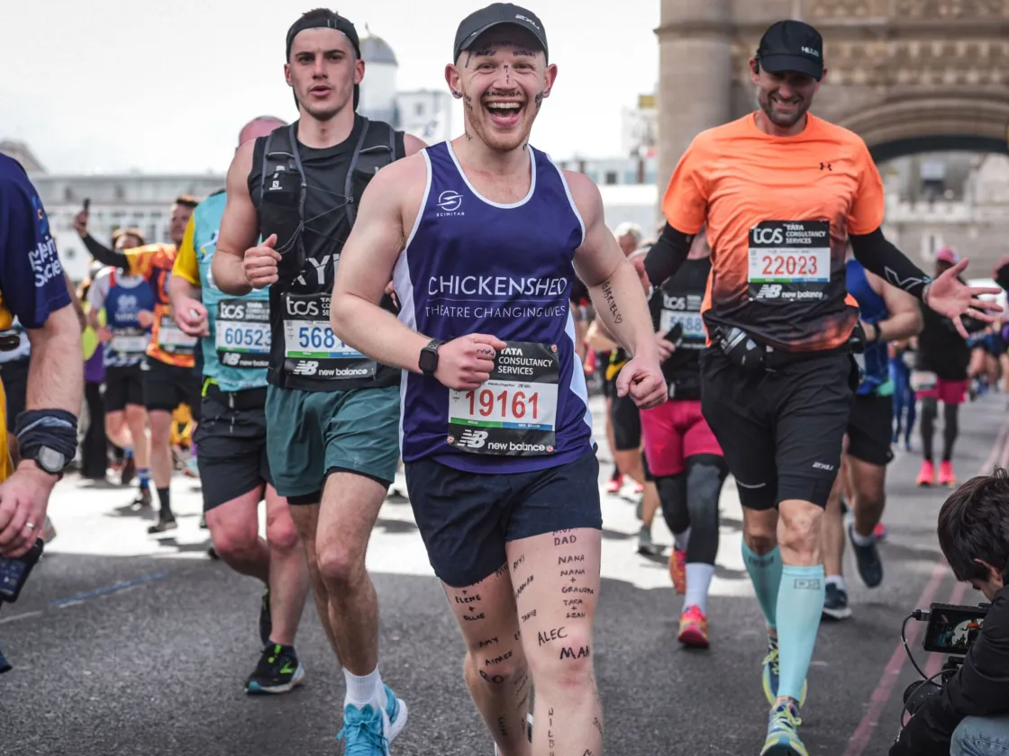 A man runs across tower bridge in the London Marathon