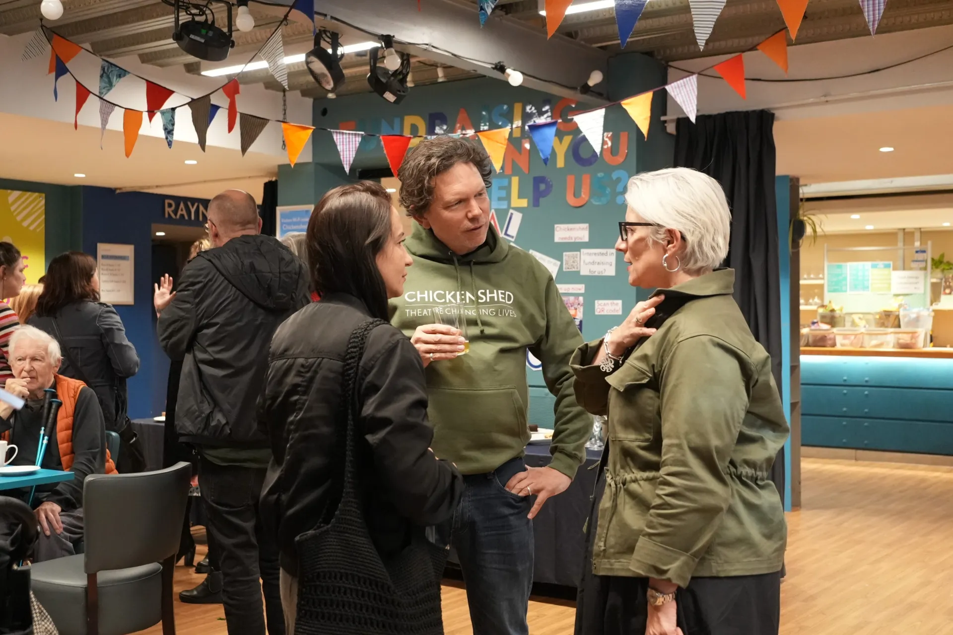 3 people reuniting at the Anansi event