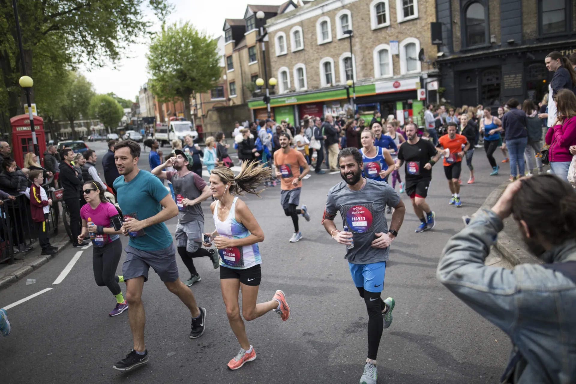 Runners running through the streets at the Hackney Half Marathon