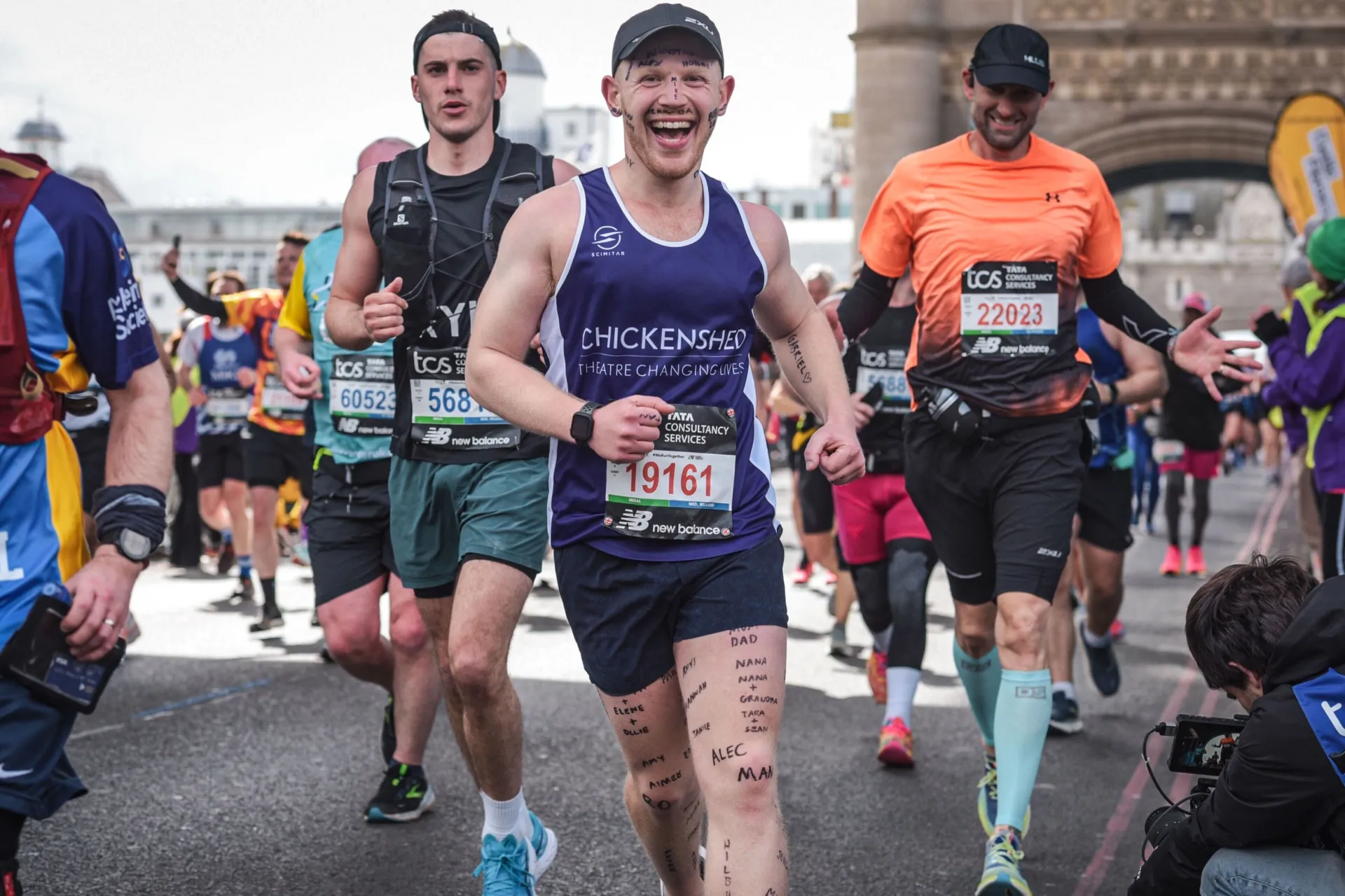 A man runs across tower bridge in the London Marathon